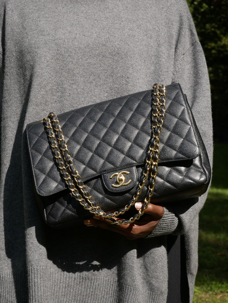 Chanel Classic flap bag with black caviar leather and gold hardware